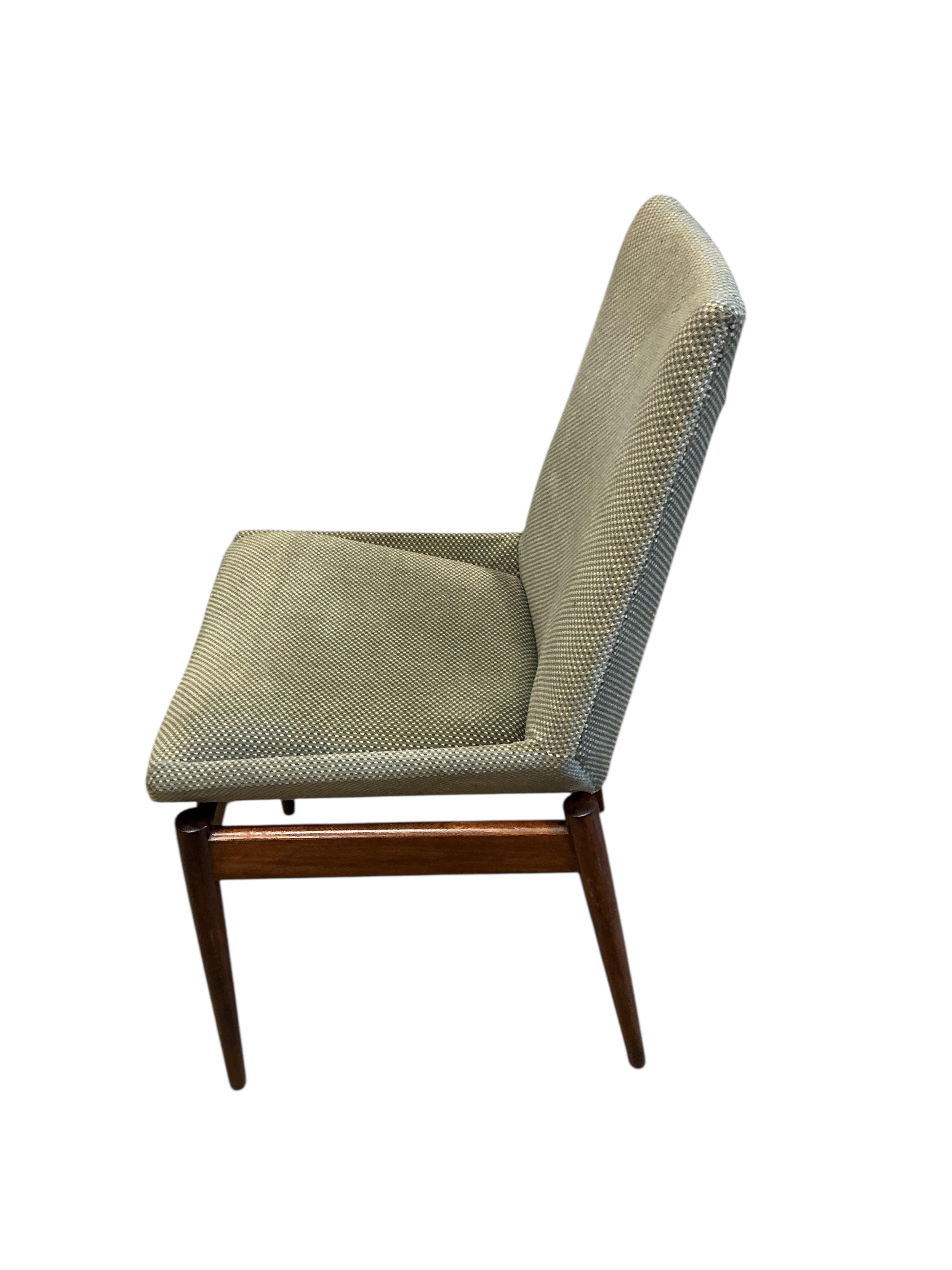 A mid century Archie Shine Indian rosewood extending dining table, width 144cm, depth 84cm, height 72cm and six upholstered chairs, two with arms